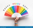 happy-pride-day-hand-holds-rainbow-fan-ribbon-rainbow-design-wrist-flat-lay-top-view-off-white...jpg