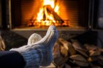 feet-woolen-socks-fireplace-woman-sitting-cosy-fire-warming-her-cold-feet-christmas-winter-moo...jpg