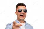 depositphotos_88697034-stock-photo-laughing-man-in-sunglasses-pointing.jpg